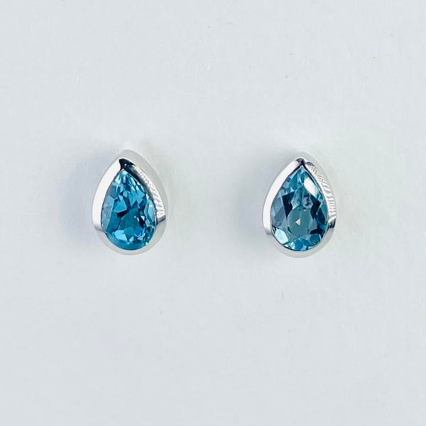 Bright sparkly tear drop blue topaz stones in a bright shiny silver surround.