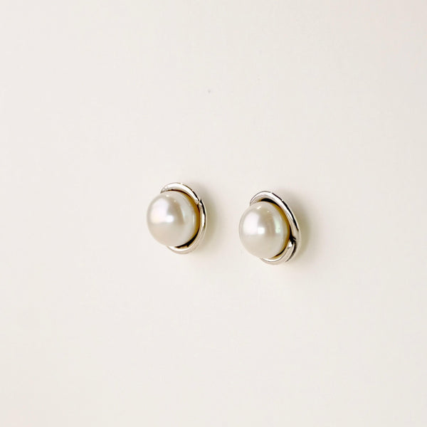 Silver and Round Pearl Stud Earrings.