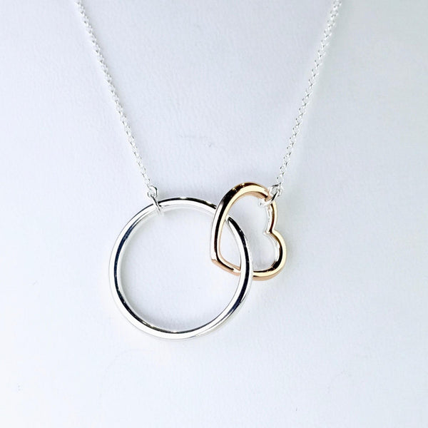 Silver Circle and Gold Plated Heart Necklace.