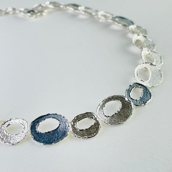 Two Tone Textured Silver Circle Linked Necklace by JB Designs.