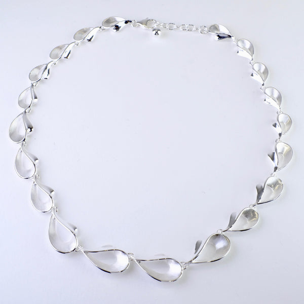 Graduated Satin and Polished Silver Linked Necklace by JB Designs.