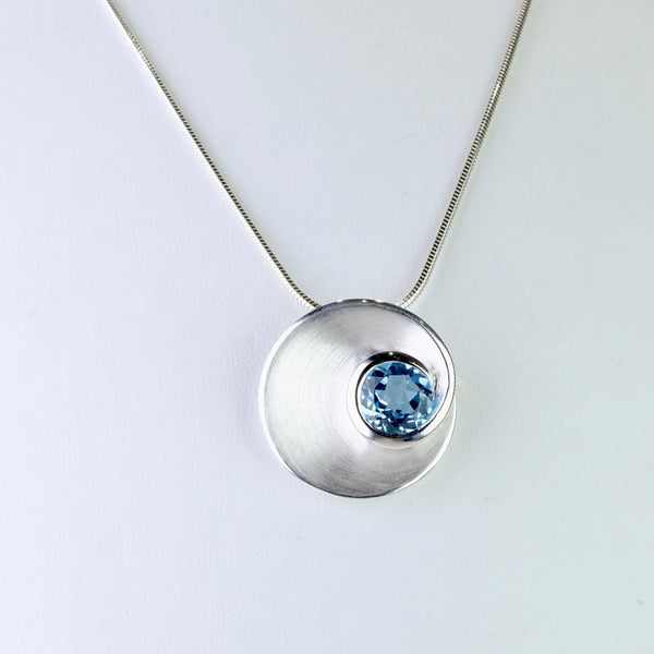 Blue Topaz and Satin Silver Pendant by JB Designs.
