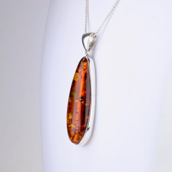 Long Elegant Amber and Silver Pendant.