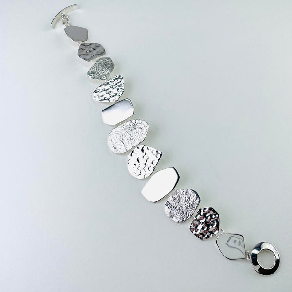 Multi Textured Silver Linked Bracelet.