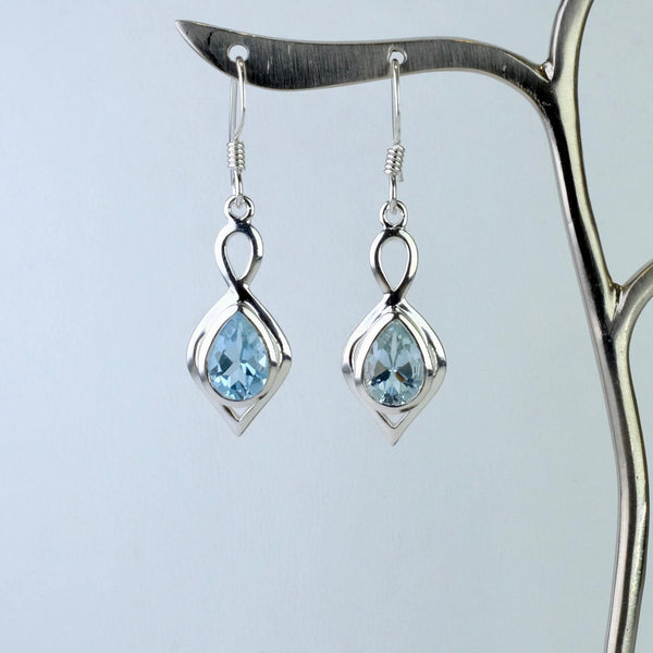 Silver and Faceted Blue Topaz Drop Earrings.