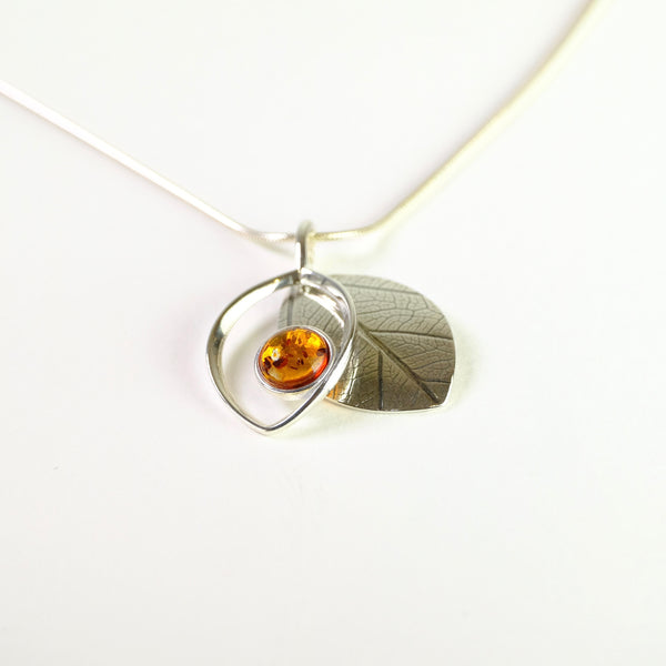 Two Piece Amber and Silver Pendant.