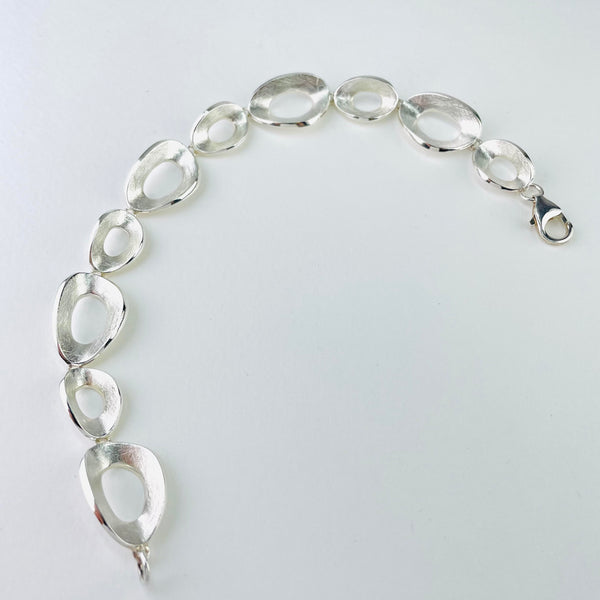 Satin, Textured Silver Linked Bracelet by JB Designs.