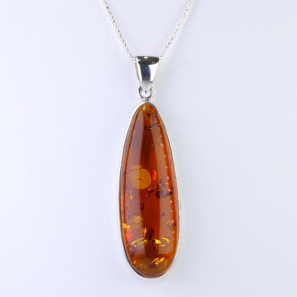 Long Elegant Amber and Silver Pendant.