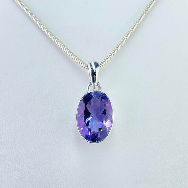 Oval Sterling Silver and Faceted Amethyst Pendant.