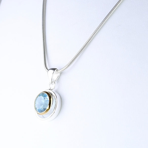 Blue Topaz and Silver and Gold Plated Pendant.