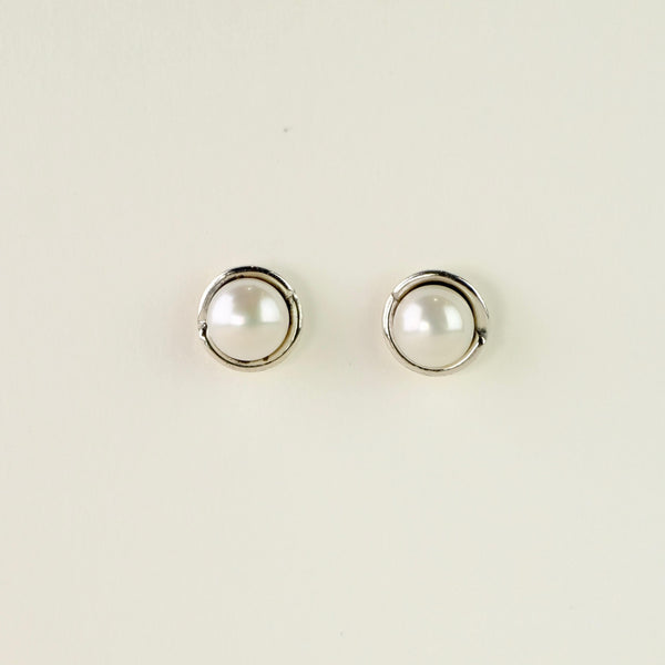 Silver and Round Pearl Stud Earrings.