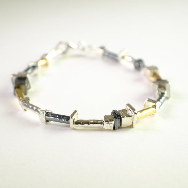Silver and Rolled Gold Linked Bracelet by JB Designs.